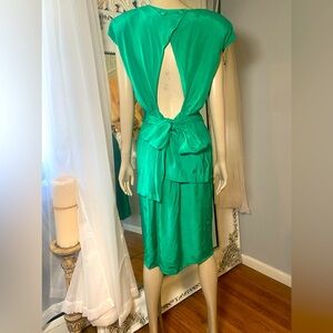 Iconic 80s vintage with asymmetric details and open back jade green